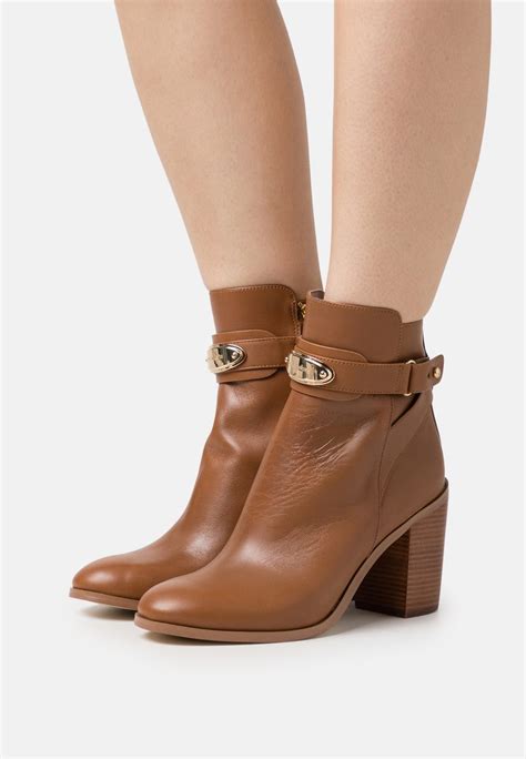 michael kors heeled ankle boots|Michael Kors adjustable buckle boots.